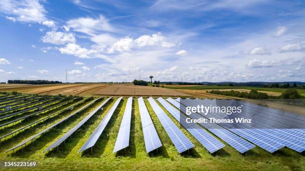 solar panel park and agricultural fields - water tower storage tank stock pictures, royalty-free photos & images