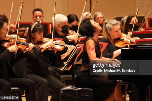 Pianist Yuja Wang performs with the Philadelphia Orchestra led by music director Yannick Nézet-Séguin during opening night at the Stern Auditorium at...