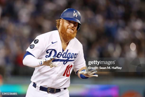 Justin Turner of the Los Angeles Dodgers celebrates his solo home run in the fourth inning against the St. Louis Cardinals during the National League...
