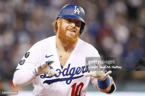 Justin Turner of the Los Angeles Dodgers celebrates his solo home run in the fourth inning against the St. Louis Cardinals during the National League...