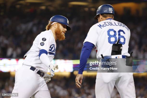 Justin Turner of the Los Angeles Dodgers celebrates his solo home run with Clayton McCullough in the fourth inning against the St. Louis Cardinals...