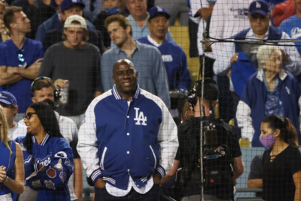 Former NBA player Magic Johnson looks on during the National League Wild Card Game between the St. Louis Cardinals and the Los Angeles Dodgers at...