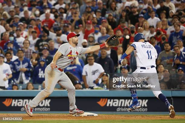 Paul Goldschmidt of the St. Louis Cardinals tags out AJ Pollock of the Los Angeles Dodgers on a ground ball to end the sixth inning during the...