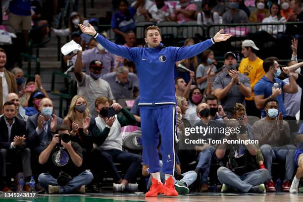 Luka Doncic of the Dallas Mavericks reacts as the Dallas Mavericks score against the Utah Jazz in the second half of a preseason NBA game at American...