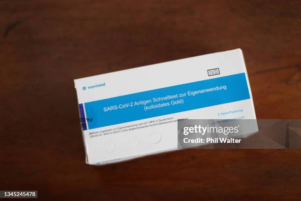 In this photo illustration, a COVID-19 rapid antigen test kit is pictured on October 07, 2021 in Auckland, New Zealand. A pilot scheme for the use of...