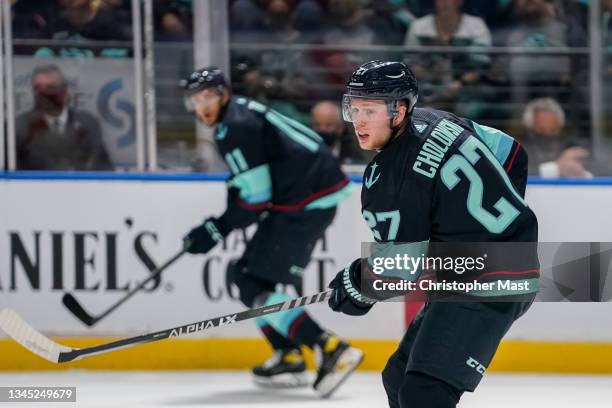 Dennis Cholowski of the Seattle Kraken skates through the neutral zone during the first period of a game between the Calgary Flames and Seattle...