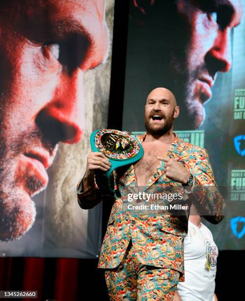 Heavyweight champion Tyson Fury gestures during a news conference at MGM Grand Garden Arena on October 6, 2021 in Las Vegas, Nevada. Fury will defend...