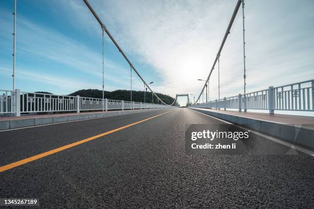 empty asphalt road of mordern bridge - straight stock pictures, royalty-free photos & images