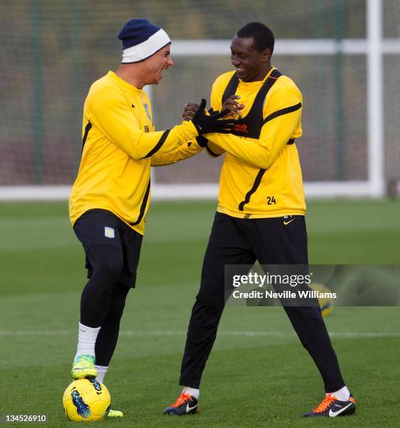 Gabriel Agbonlahor and Emile Heskey compete for the ball during an Aston Villa training session at the club's training ground at Bodymoor Heath on...