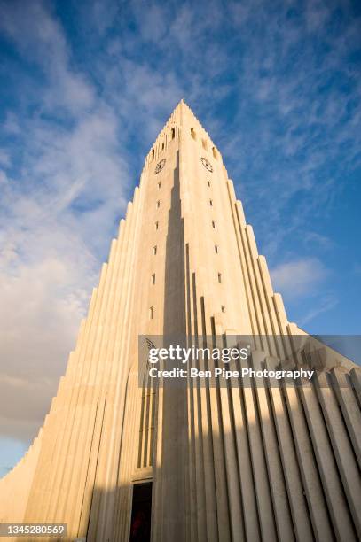 iceland, reykjavik, low angle view of hallgrimskirkja lutheran church exterior - hallgrimskirkja bildbanksfoton och bilder