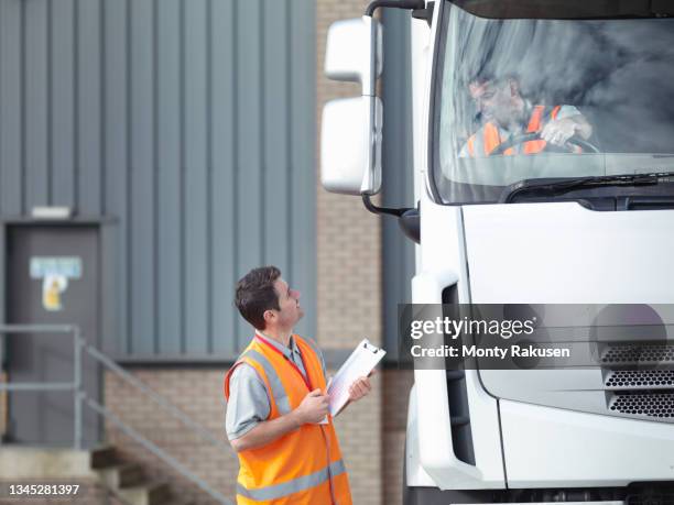 uk, truck driver talking to driving instructor - fahrschule stock-fotos und bilder
