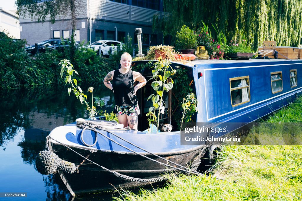 British woman and senior dog aboard their floating home