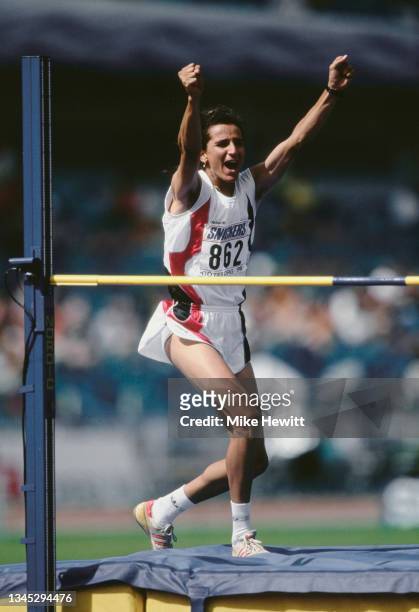 Gold medalist Ghada Shouaa of Syria celebrates clearing the bar in the High Jump discipline of the Women's Heptathlon competition at the 5th...
