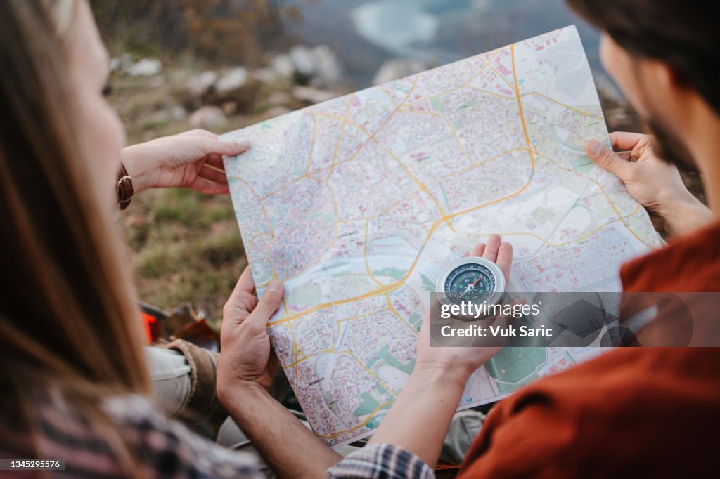 Campers using compass and a map