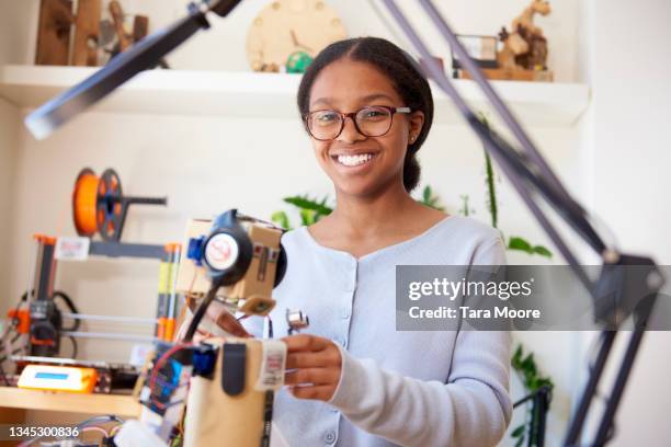 teenage girl building robot - girls coding stock pictures, royalty-free photos & images