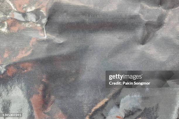 close up silver plastic foil background, abstract background of silver color from paper. - carta stagnola foto e immagini stock