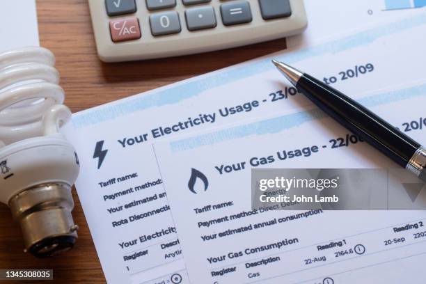 close-up of gas and electric bills. - british stock pictures, royalty-free photos & images