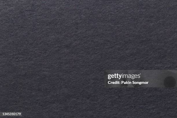 very dark grayish blue color eco recycled kraft paper sheet texture cardboard background. - grau stock-fotos und bilder