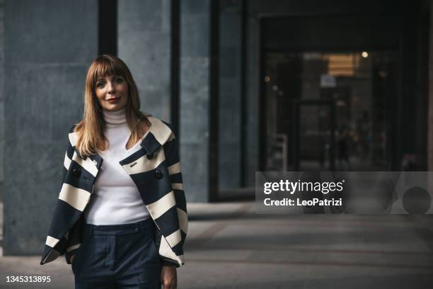 businesswoman portrait in the city downtown - generation x stock pictures, royalty-free photos & images