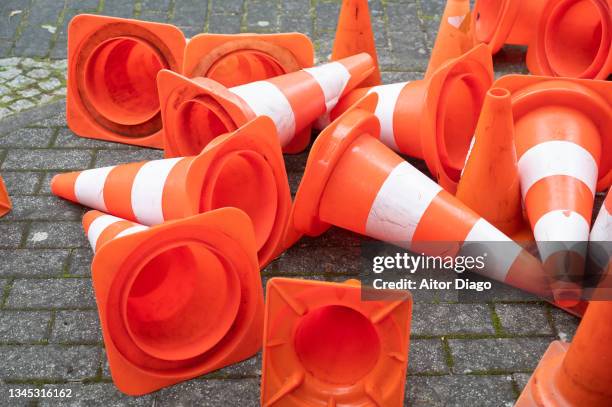 a bunch of traffic warning cones. germany. - cone shape stock pictures, royalty-free photos & images