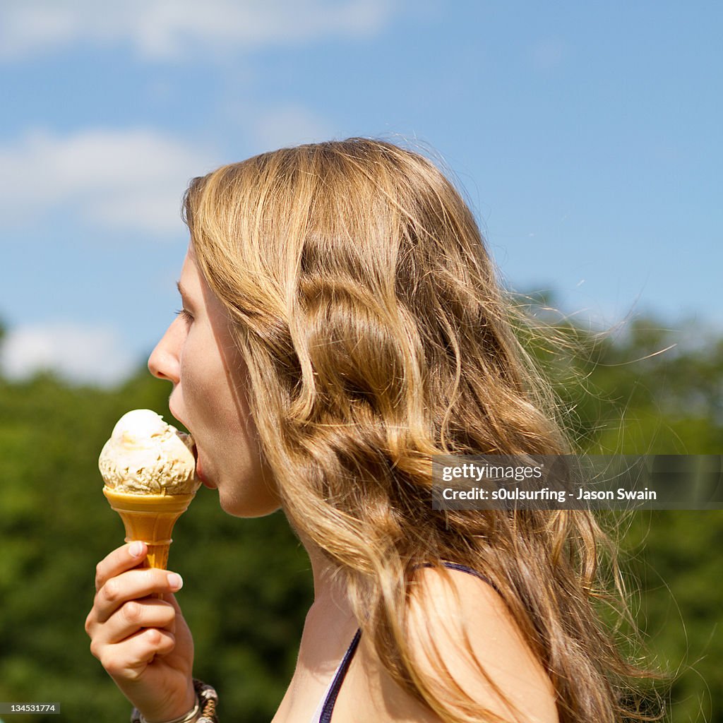 Teenage girl enjoying ice cream cone