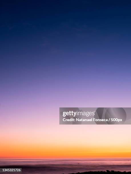 scenic view of sea against clear sky during sunset,puntarenas province,savegre de aguirre,costa rica - sunset gradient stock pictures, royalty-free photos & images