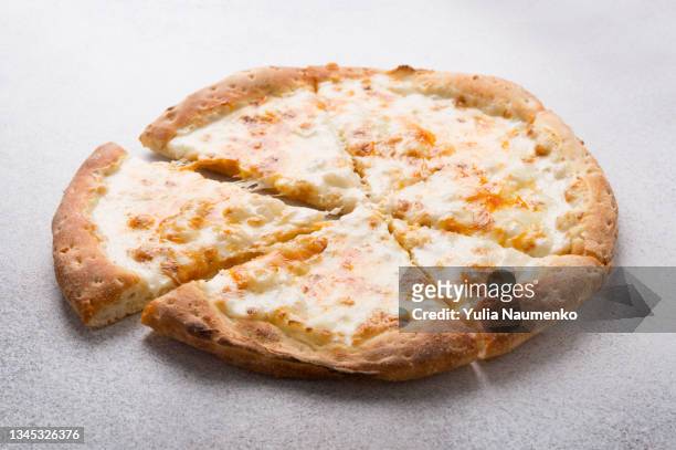 pizza with cheese on a light background - pizza crust stock pictures, royalty-free photos & images