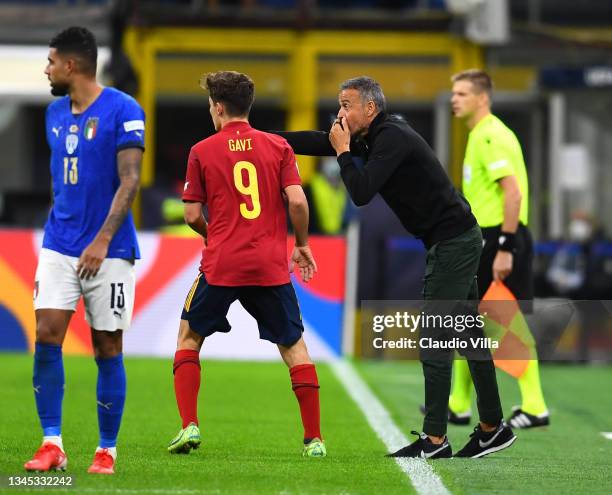 Head coach Spain Luis Enriquee and Pablo Martín Páez Gavira, Gavi, of Spain chat during the UEFA Nations League 2021 Semi-final match between Italy...