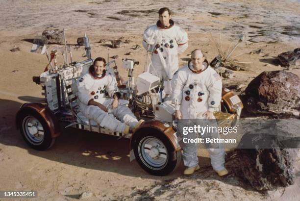 Apollo 16 astronauts Charles M Duke, John W Young, and Thomas K Mattingly II take a break during a training exercise in preparation for the Lunar...