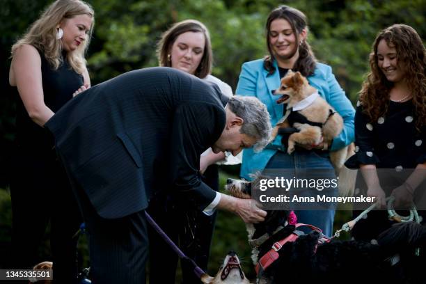 Sen. John Kennedy pets a dog during a press conference on Sen. Rand Paul's FDA Modernization Act on Capitol Hill on October 07, 2021 in Washington,...