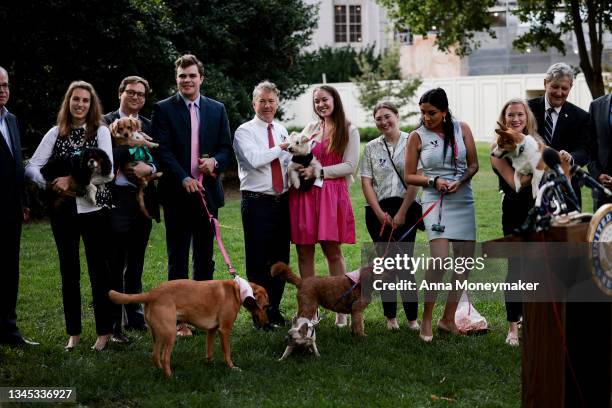 Sen. Rand Paul poses for a photo with Senate staff members and their dogs after a press conference on Sen. Paul's FDA Modernization Act on Capitol...