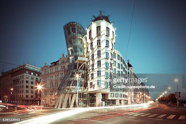 buildings with trail lights at night - prague stock pictures, royalty-free photos & images