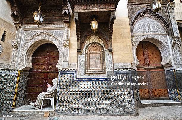 man sitting on doorway - luisapuccini stock pictures, royalty-free photos & images