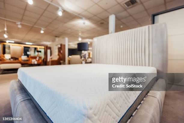 showroom bed and mattress - mattress stock pictures, royalty-free photos & images
