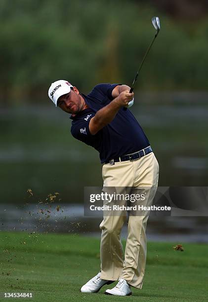 Graeme McDowell of Northern Ireland in action during the second round of the Nedbank Golf Challenge at the Gary Player Country Club on December 2,...