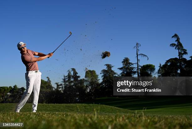 Haotong Li of China plays his second shot on the 16th hole during Day One of The Open de Espana at Club de Campo Villa de Madrid on October 07, 2021...