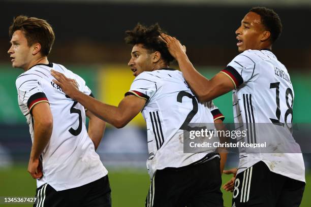 Kevin Schade of Germany celebrates the second goal to 2-2 with Noah Katterbach of Germany and Jamie Leweling of Germany during the 2022 UEFA European...