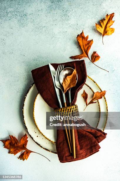 autumnal rustic table setting with fall foliage decorations - napkin ring stock pictures, royalty-free photos & images