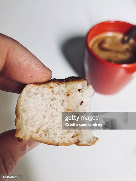 person enjoying a cup of black coffee with a piece of cake - taken on mobile device stock pictures, royalty-free photos & images