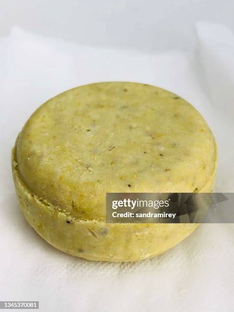 close-up of a solid shampoo bar on a table - solid soap stock pictures, royalty-free photos & images