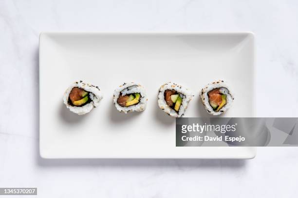 top view of a sushi plate on a marble table - comida japonesa fotografías e imágenes de stock