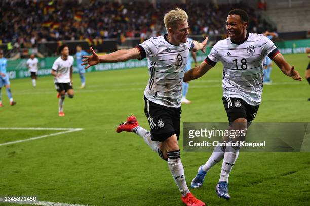 Jonathan Burkardt of Germany celebrates the third goal to 3-2 with Jamie Leweling of Germany during the 2022 UEFA European Under-21 Championship...