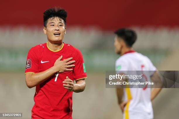 Lei Wu of China PR celebrates scoring the second goal against Vietnam during the FIFA World Cup Asian Qualifier final round Group B match between...