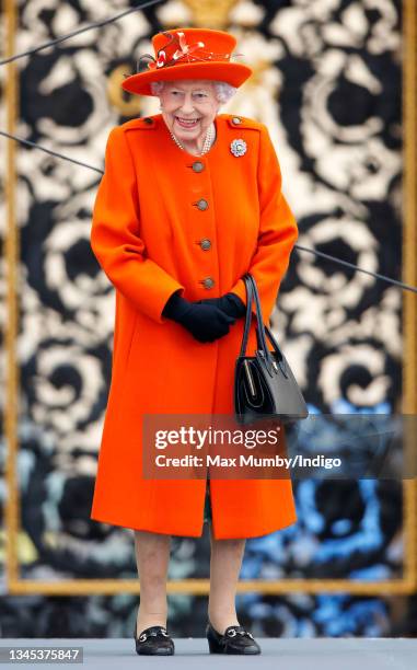 Queen Elizabeth II attends the launch of the Queen's Baton Relay for Birmingham 2022, the XXII Commonwealth Games at Buckingham Palace on October 7,...