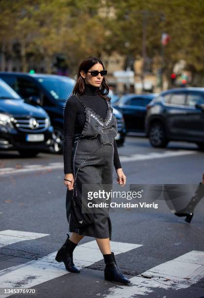 Deborah Reyner Sebag seen wearing grey dress, black turtleneck outside Miu Miu during Paris Fashion Week - Womenswear Spring Summer 2022 on October...