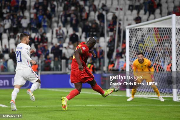 Romelu Lukaku of Belgium scores their side's second goal past Hugo Lloris of France during the UEFA Nations League 2021 Semi-final match between...