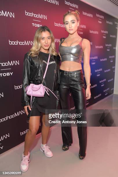 Georgia Harrison and Kaz Crossley attend the boohooMAN x Toby Launch event on October 07, 2021 in London, England.