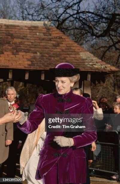 British Royal Princess Alexandra, The Honourable Lady Ogilvy, wearing a purple velvet coat and matching hat, arriving at St Andrew's Parish Church in...