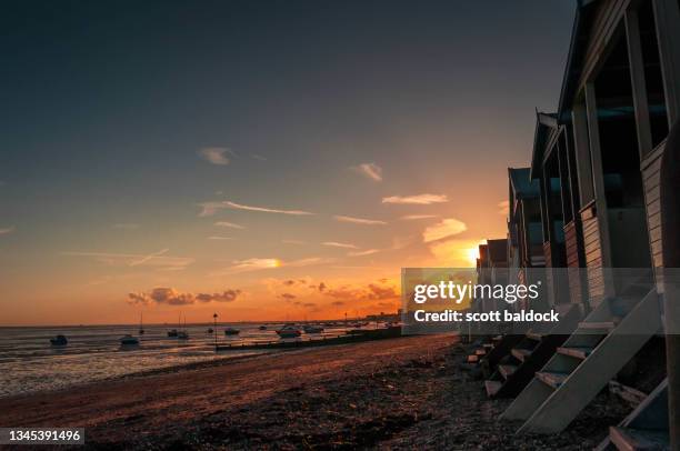 beach huts at sunset - southend stock pictures, royalty-free photos & images