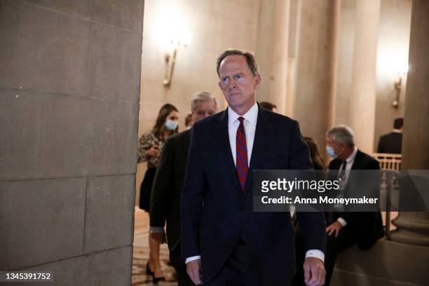 Sen. Patrick Toomey arrives to a meeting with Republican Senators on their party's plan for the vote on the debt limit at the U.S. Capitol on October...